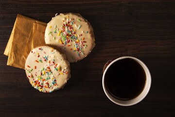 Canvas Print - Closeup shot of delicious homemade Colombian cookies with a cup of dark coffee on the table