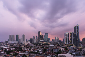 Wall Mural - Aerial view of Jakarta business disrict skyline with a dramatic sky at sunset