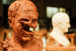© Cavan Images - Destructed clay head in art studio