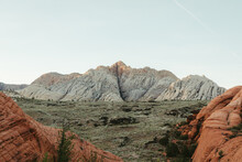 Desert Landscape Of Red Rock White Cliffs And Green Valley In Utah