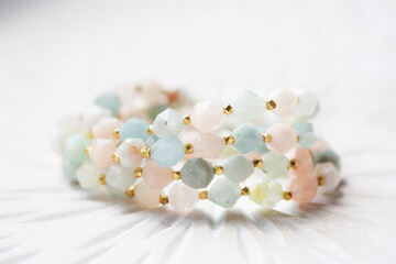 Wall Mural - Cubic faceted morganite mineral stone beads bracelet on white background