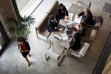 Team Of Financial Advisors Planning With Business Colleagues During Meeting At Law Firm