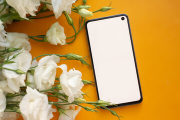 Wall Mural - phone mockup. smartphone with eustoma flowers. minimalist 