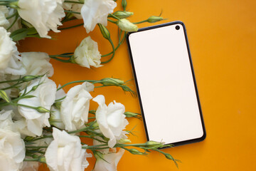 Wall Mural - phone mockup. smartphone with eustoma flowers. minimalist 