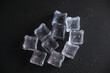 © vfhnb12 - Ice cubes on a reflecting table with drops of water on a black background