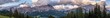 Dolomiten Panorama von der Punta Fiames über den Cristallo bis zur Sorapis im Sommer am Abend mit Bewölkung