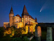 Comet in night sky over Corvin Castle, Hunedoara, Transylvania, Romania