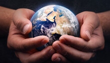 Earth Planet Globe In Hands. Dark Background. Care And Protection Of Our Home. Ecology And Environment. Elements Of This Image Furnished By NASA