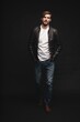 © opolja - Fashion man, Handsome serious beauty male model portrait wear leather jacket, young guy over black background