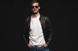 © opolja - Fashion man, Handsome serious beauty male model portrait wear sunglasses and leather jacket, young guy over black background