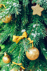 Wall Mural - Green fir tree with golden balls. Christmas wallpaper.