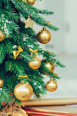 Wall Mural - Green fir tree with golden balls. Christmas wallpaper.