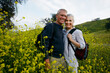 © Tetra Images - Caucasian couple standing in tall grass