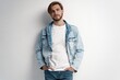 Fashion portrait of young man wearing jeans jacket
