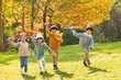 © View Stock - Happy children playing in the park with a toy plane