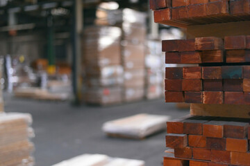 Wall Mural - Timber Flooring Factory. Pile of cut wood in factory storage warehouse. Lumber in warehouse.