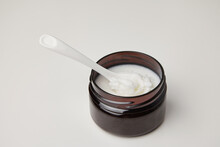 Dark Jar With Organic Pure Shea Butter Base Oil. Natural Cosmetics.