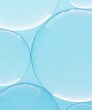 © Westend61 - Three dimensional render of transparent glass spheres against blue background