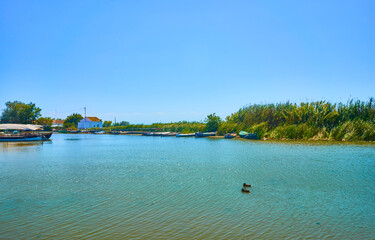 pier and fishing boats in the lagoon 