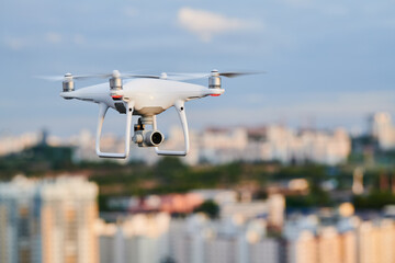 Wall Mural - drone with digital camera flying at city street