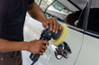 © khunkornStudio - Man hands holding the work tool polish the car.Buffing and polishing car. Car detailing.
