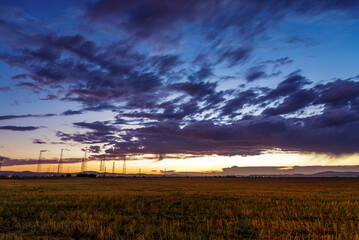 Canvas Print - Dramatic sunset over a field