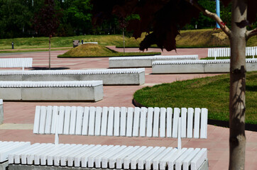 white wooden benches on a deserted boulevard