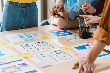 asian businessmen and businesswomen meeting brainstorming ideas about creative web design planning a