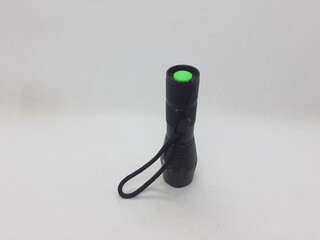 Black Military Style Technical Stainless Steel LED Bright Electric Flashlight in White Isolated Background