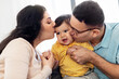 © Syda Productions - family and people concept - happy mother and father kissing baby son at home