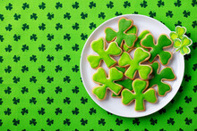 Shamrock Cookies, St. Patrick's Day Dessert. Green Textile Background. Copy Space. Top View.