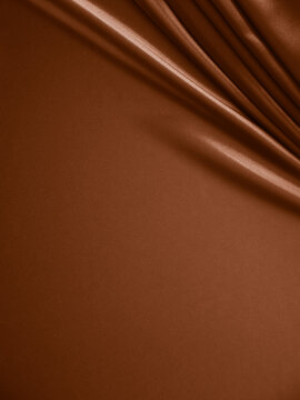 Wall Mural - Beautiful elegant wavy brown satin silk luxury cloth fabric texture, abstract background design. Copy space.