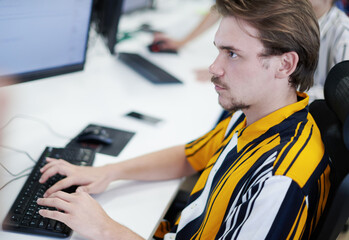 Poster - casual business man working on desktop computer