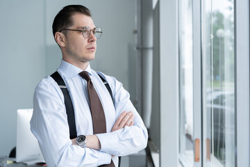 Canvas Print - Portrait Of Businessman Standing By Window In Office