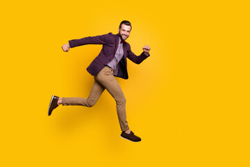 Wall Mural - Full size profile photo of handsome stylish well-dressed business guy jump high up rushing store mall sales season wear plaid shirt blazer trousers shoes isolated yellow color background