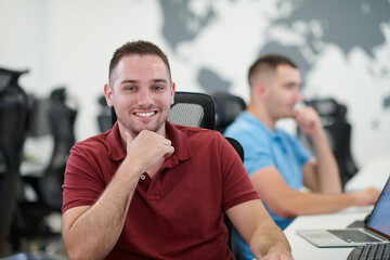 two male software developers working on computer