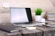 © Tony Alexson - Stylish workspace with computer and posters on home or studio.