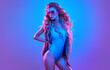 © evgenij918 - Fashion. Woman in Colorful neon light. Sexy girl in disco bodysuit, makeup. Party disco neon nightclub vibes. Fashionable model portrait, creative art neon pink blue light