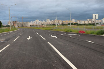 newly built street road with traffic symbols