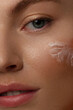 Close up of the face of a beautiful woman with perfect skin thanks to creams to keep young and cream contour anti-aging and wrinkle eyes. Concept of beauty, cleanliness and perfection