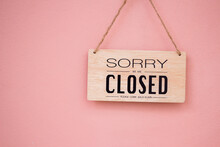Sorry We're Closed Sign.  Image Hanging On In Pink Wall