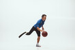 © master1305 - Athlete with disabilities or amputee on white studio background. Professional male basketball player with leg prosthesis training in studio. Disabled sport and healthy lifestyle concept. Achievements.