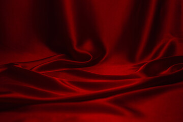 Red silk or satin luxury fabric texture can use as abstract background.