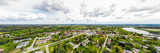 Fototapeta Miasto - Aerial panoramic view of city Inkeroinen at river Kymijoki, Finland.