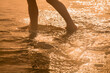 © zwiebackesser - Silhouette of child on the beach against water of sea. Summer holiday concept.
