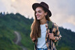 Portrait of free happy smiling attractive backpacker woman traveler during traveling alone in the mountains