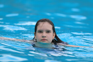 portrait of a young girl in the pool