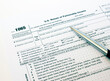 © Den-Dubinko - US tax form 1065 with a silver pen