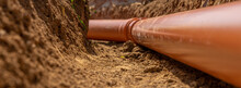 Plastic Pipes In The Ground During The Construction Of A Building, Bunner With Copy Space