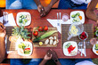 © Gerald Carter/Creative Flame - Overhead view of family praying together before farm to table meal